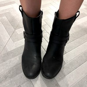 Black combat-style boots in size 7.5